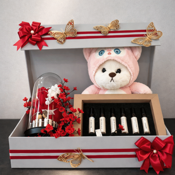 Romantic Anniversary Gift for Wife hamper featuring perfume set, teddy bear, and rose display
