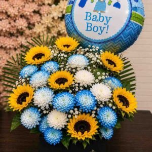 A celebratory flower box for a new baby boy, available for Baby boy gift delivery Lahore.
