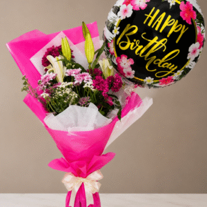 A vibrant birthday flower bouquet with a festive balloon.