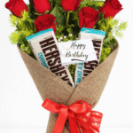 Birthday chocolate and rose bouquet delivery featuring Hershey's bars and fresh red roses.