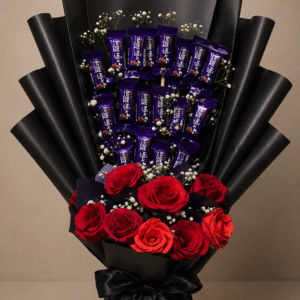 A luxurious chocolate and rose bouquet wrapped in black paper.