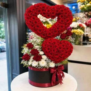 A double heart-shaped rose box available for rose delivery Lahore.