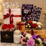 A luxury gift hamper with flowers, chocolates, and a mug, ideal for gifts for women in Lahore.