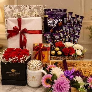 A luxury gift hamper with flowers, chocolates, and a mug, ideal for gifts for women in Lahore.