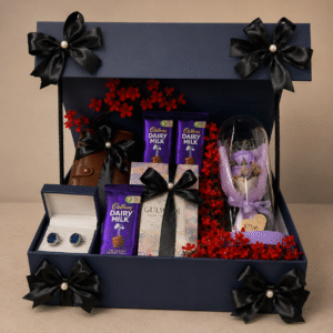 A luxury gift box for men containing cufflinks, chocolates, and a preserved rose.