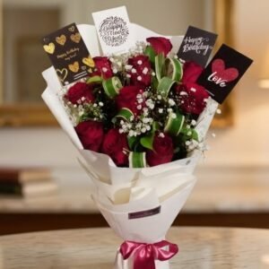 Close-up of a classic Red Rose Bouquet with multi-occasion greeting cards on a marble surface.