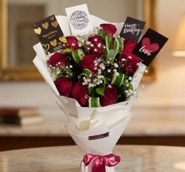 Close-up of a classic Red Rose Bouquet with multi-occasion greeting cards on a marble surface.
