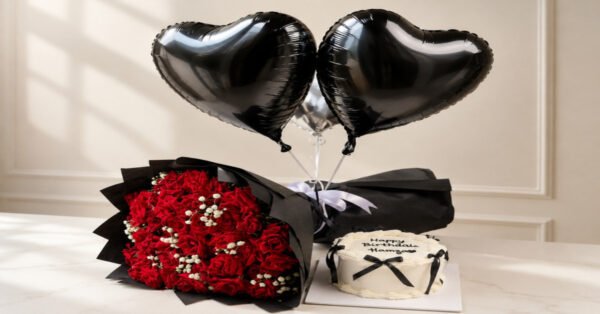 A red rose bouquet, heart balloons, and birthday cake perfect for those seeking Birthday gifts in Lahore.