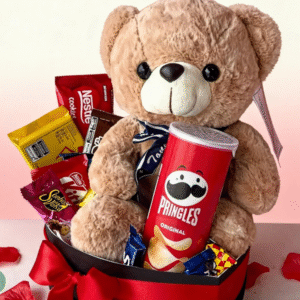 Teddy bear gift basket with Pringles and chocolates, premium gift arrangement with a plush teddy bear, snack treats, and elegant presentation