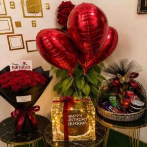 A complete birthday gift set with flowers, cake, and snacks for Birthday gift delivery Lahore.
