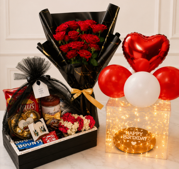 A luxurious birthday gift set featuring snacks, flowers, and balloons for those looking to Send cakes to Pakistan from USA.