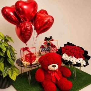 A grand Valentine's gift set featuring a teddy bear and flowers, available for Valentine's gift delivery Lahore.