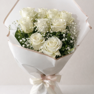 A bouquet of 9 fresh white roses with baby's breath used for white rose bouquet delivery.