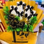 Elegant black and gold arrangement ideal for Eid gifts for wife.