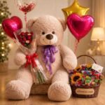 Premium gift hampers in Lahore featuring a teddy bear, roses, and snack basket.
