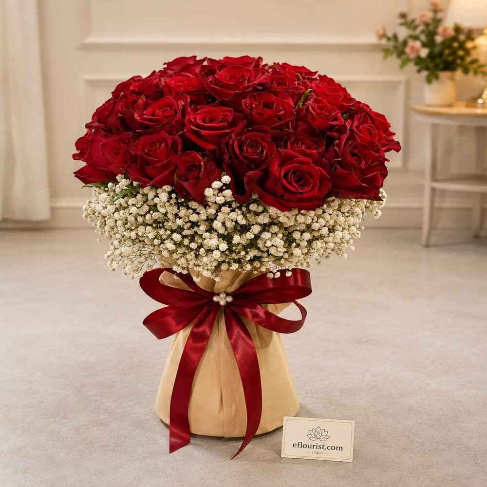 A luxurious bouquet of red roses and baby's breath from a professional flower shop in Lahore.