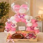 Premium balloon arch and chocolate cake arrangement for congratulations gifts.