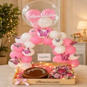 Premium balloon arch and chocolate cake arrangement for congratulations gifts.