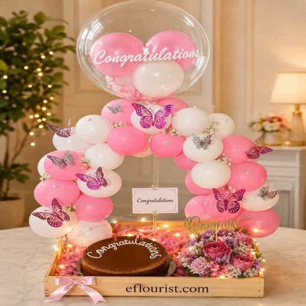 Premium balloon arch and chocolate cake arrangement for congratulations gifts.