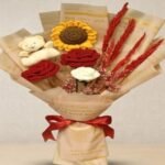 A handcrafted crochet sunflower and teddy bear bouquet, a top choice for unique gifts in Lahore.