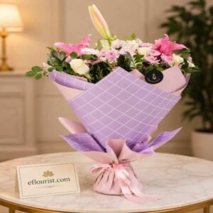 An elegant bouquet of pink and white lilies from a top flower shop Lahore.