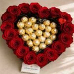 Heart-shaped red roses and chocolates for romantic gift delivery Pakistan.