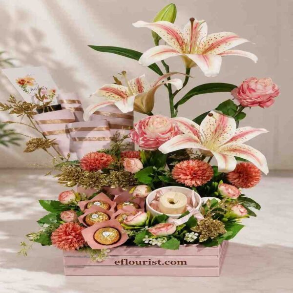 Elegant lilies and chocolates in a box, available through our gift delivery services.