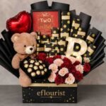 A luxury anniversary gift hamper featuring a teddy bear and chocolates, available for Gift delivery Lahore.