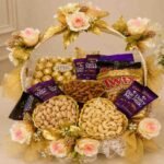 Elegant deluxe chocolate gift basket with assorted chocolates and nuts.