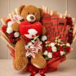 A teddy bear, chocolate, and lily bouquet available for Gift delivery Lahore.
